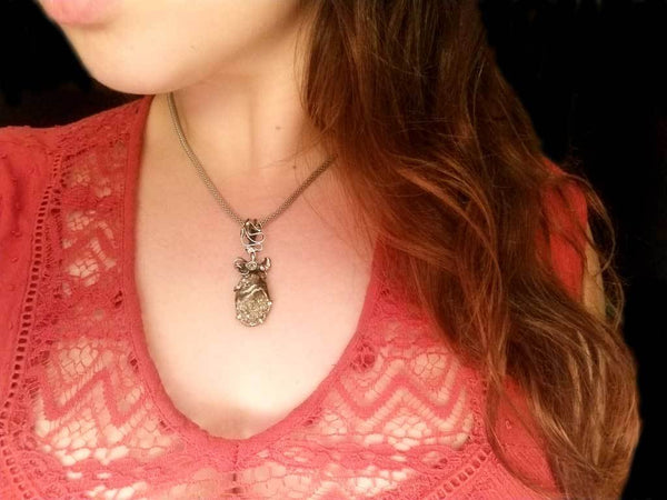 Alena Zena Pyritized Trilobite with Peridot Pendant for $219 at Mystical Earth Gallery (On Model)